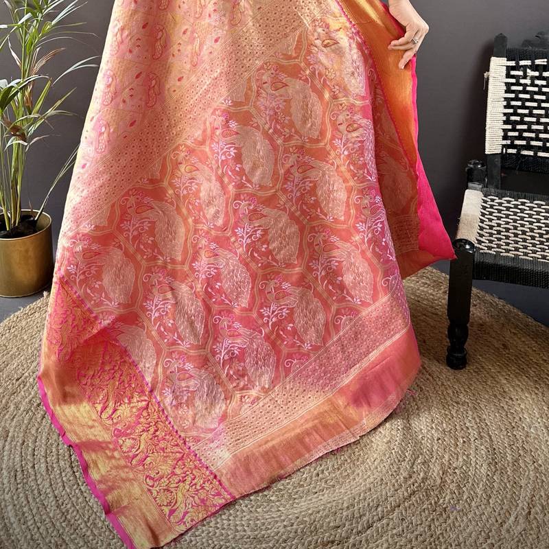 pink silk blend blend zari woven saree with unstitched blouse piece.