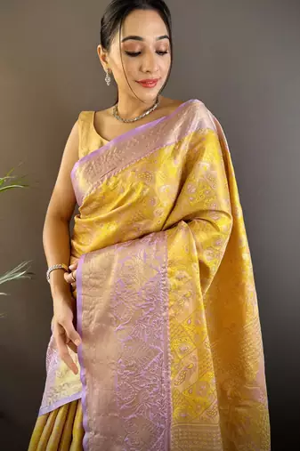 yellow silk blend blend zari woven saree with unstitched blouse piece.