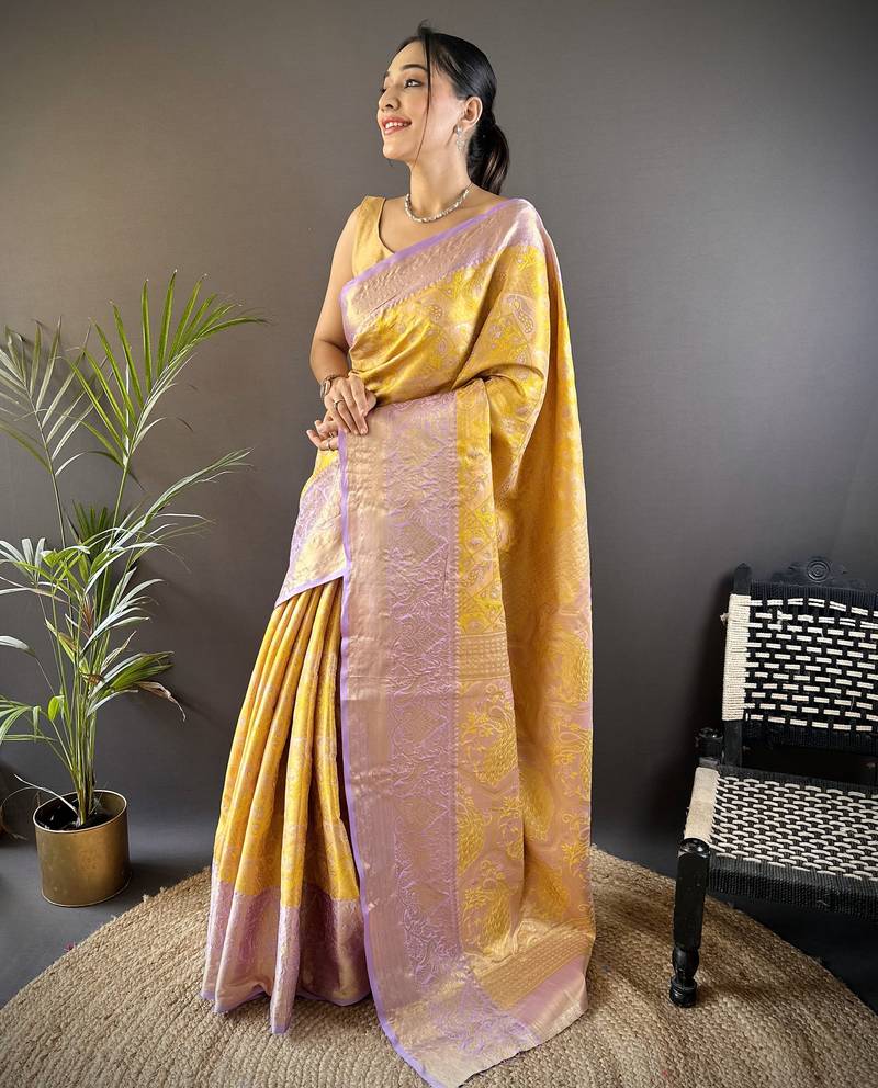 yellow silk blend blend zari woven saree with unstitched blouse piece.