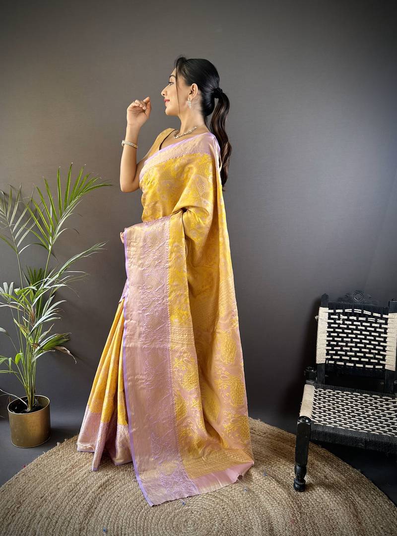yellow silk blend blend zari woven saree with unstitched blouse piece.