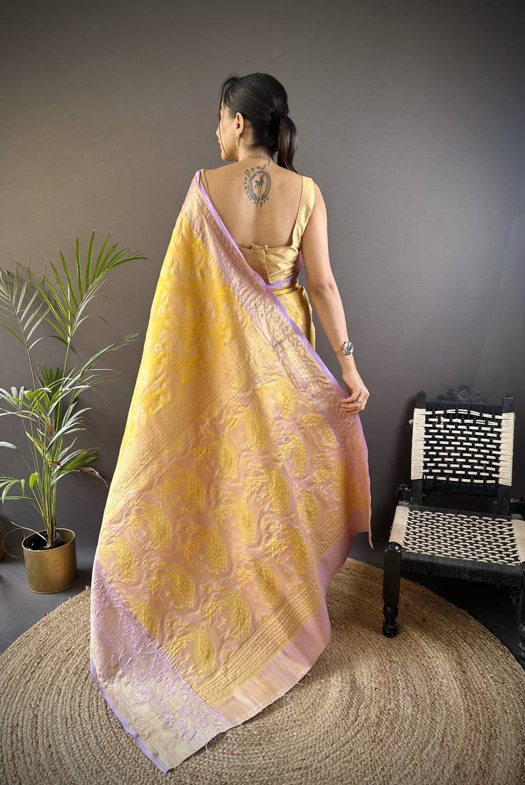 yellow silk blend blend zari woven saree with unstitched blouse piece.
