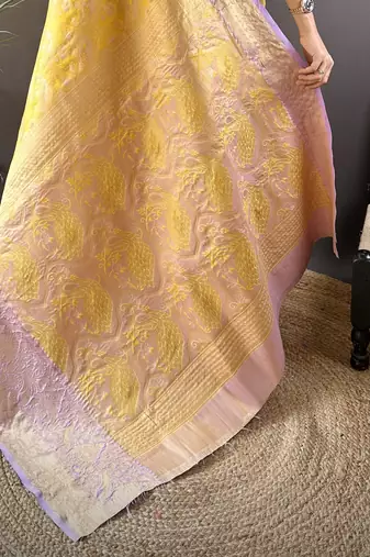 yellow silk blend blend zari woven saree with unstitched blouse piece.