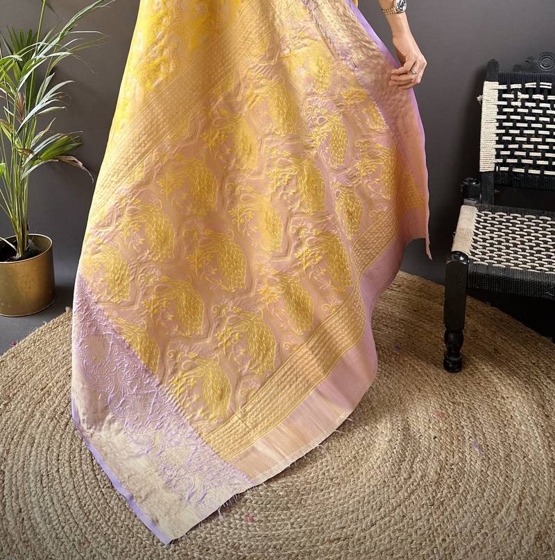 yellow silk blend blend zari woven saree with unstitched blouse piece.