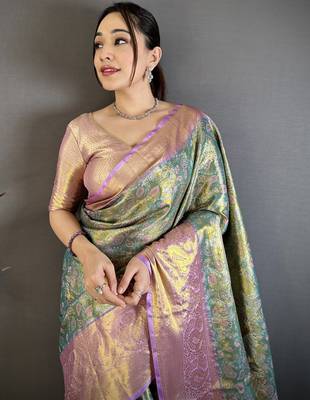 green kanjeevaram silk blend zari woven saree with unstitched blouse piece. 1