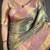 green kanjeevaram silk blend zari woven saree with unstitched blouse piece.
