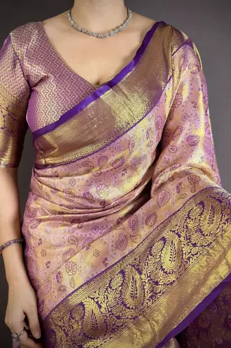 lilac kanjeevaram silk blend zari woven saree with unstitched blouse piece.