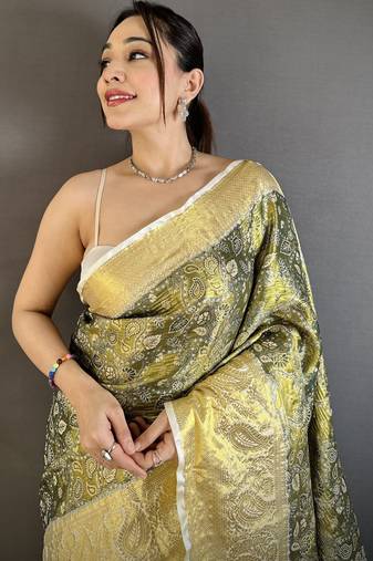 olive kanjeevaram silk blend zari woven saree with unstitched blouse piece.