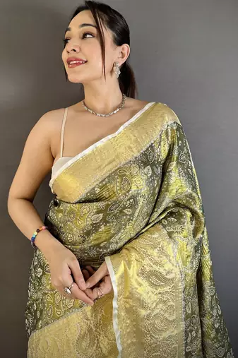olive kanjeevaram silk blend zari woven saree with unstitched blouse piece.
