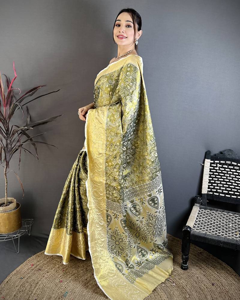 olive kanjeevaram silk blend zari woven saree with unstitched blouse piece.