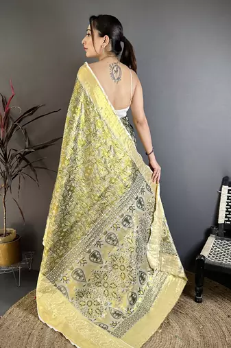 olive kanjeevaram silk blend zari woven saree with unstitched blouse piece.