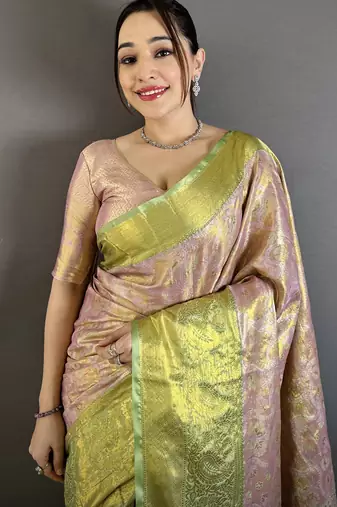 pink kanjeevaram silk blend zari woven saree with unstitched blouse piece.