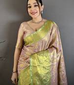 pink kanjeevaram silk blend zari woven saree with unstitched blouse piece.