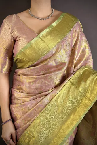 pink kanjeevaram silk blend zari woven saree with unstitched blouse piece.