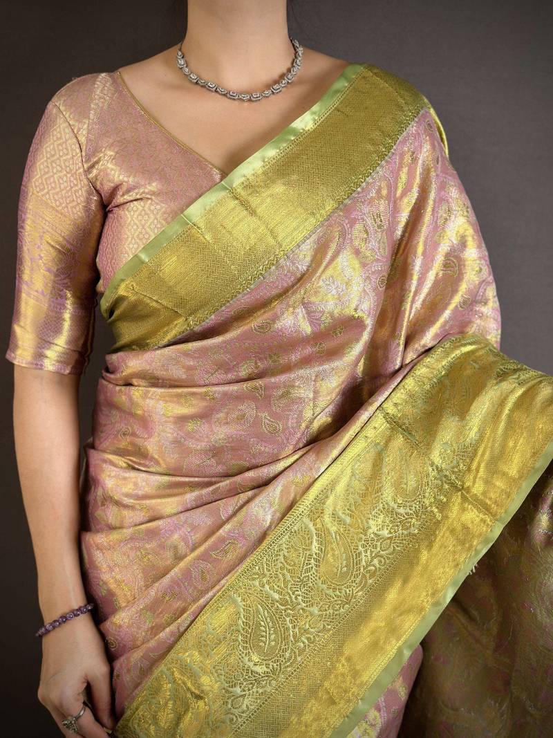 pink kanjeevaram silk blend zari woven saree with unstitched blouse piece.