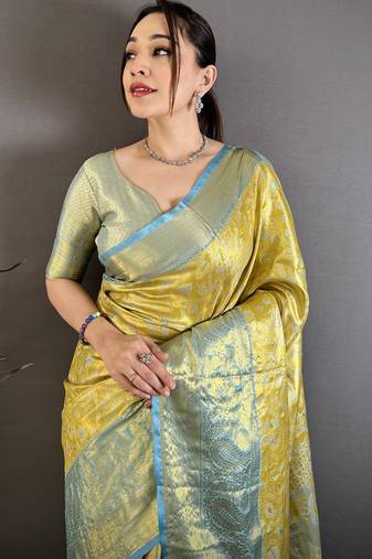 yellow kanjeevaram silk blend zari woven saree with unstitched blouse piece.