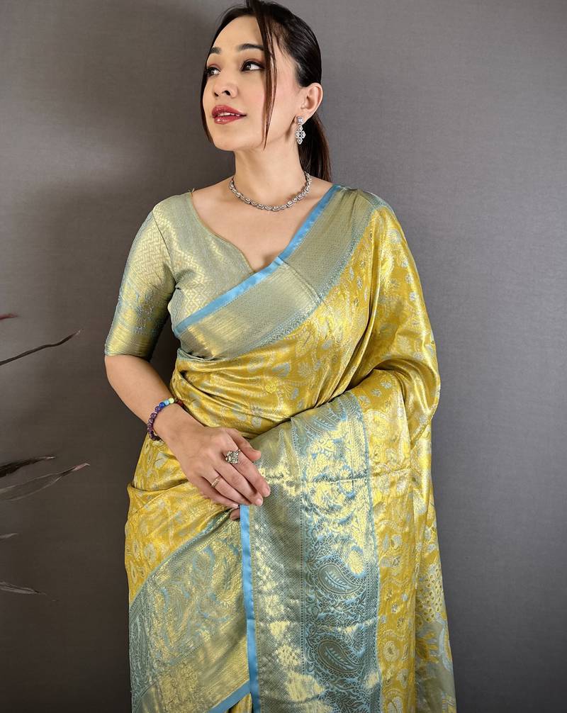 yellow kanjeevaram silk blend zari woven saree with unstitched blouse piece.