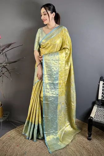 yellow kanjeevaram silk blend zari woven saree with unstitched blouse piece.