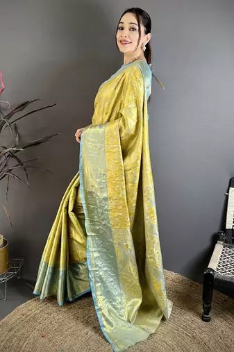 yellow kanjeevaram silk blend zari woven saree with unstitched blouse piece.