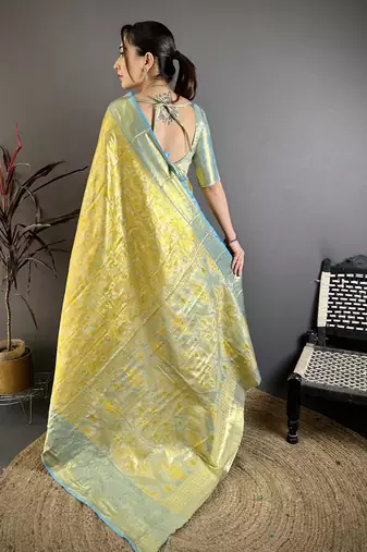 yellow kanjeevaram silk blend zari woven saree with unstitched blouse piece.