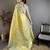 yellow kanjeevaram silk blend zari woven saree with unstitched blouse piece.