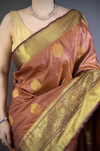 brown soft silk blend zari woven saree with unstitched blouse piece.