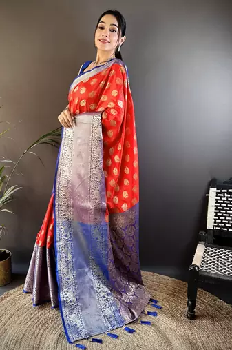 red kanjeevaram silk blend zari woven saree with unstitched blouse piece.