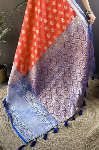 red kanjeevaram silk blend zari woven saree with unstitched blouse piece.