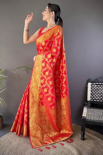 red soft silk blend banarasi zari woven saree with unstitched blouse piece.