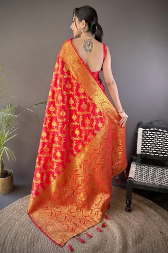red soft silk blend banarasi zari woven saree with unstitched blouse piece.