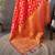 red soft silk blend banarasi zari woven saree with unstitched blouse piece.