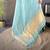 sky blue soft cotton blend zari checks saree with unstitched blouse piece.