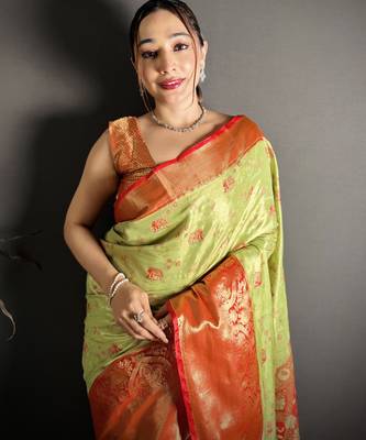 green kanjeevaram silk blend zari woven saree with unstitched blouse piece. 1