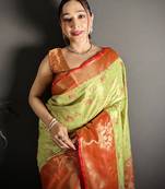 green kanjeevaram silk blend zari woven saree with unstitched blouse piece.