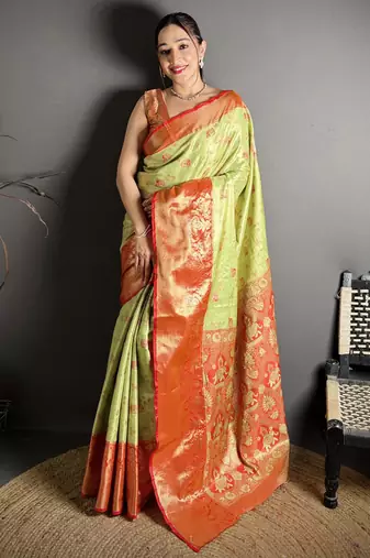 green kanjeevaram silk blend zari woven saree with unstitched blouse piece.