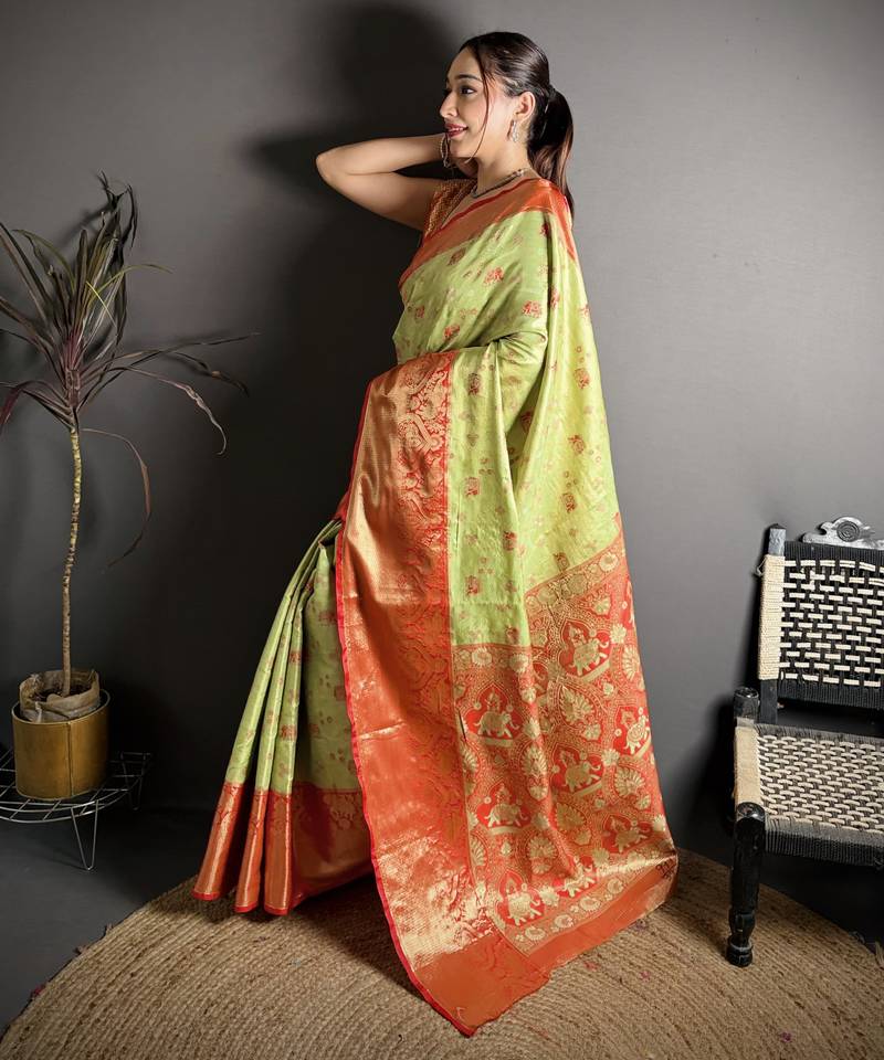 green kanjeevaram silk blend zari woven saree with unstitched blouse piece.