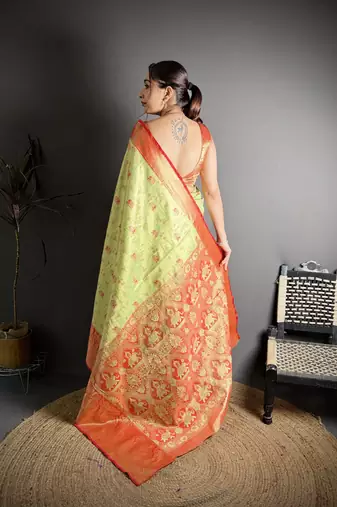 green kanjeevaram silk blend zari woven saree with unstitched blouse piece.