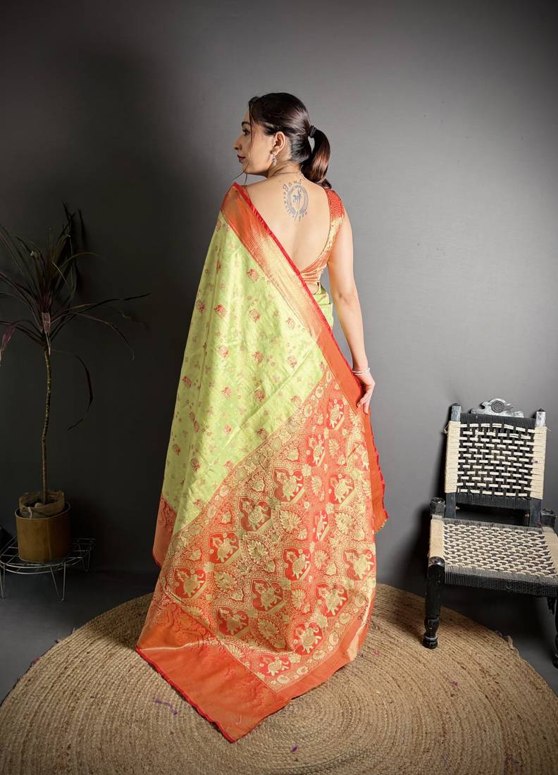 green kanjeevaram silk blend zari woven saree with unstitched blouse piece.