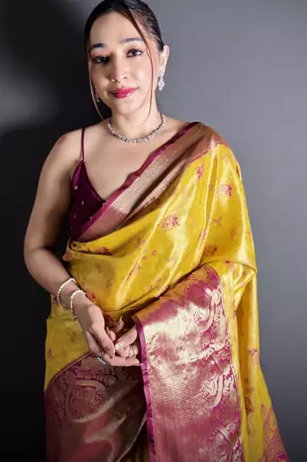 yellow kanjeevaram silk blend zari woven saree with unstitched blouse piece.