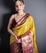 yellow kanjeevaram silk blend zari woven saree with unstitched blouse piece.