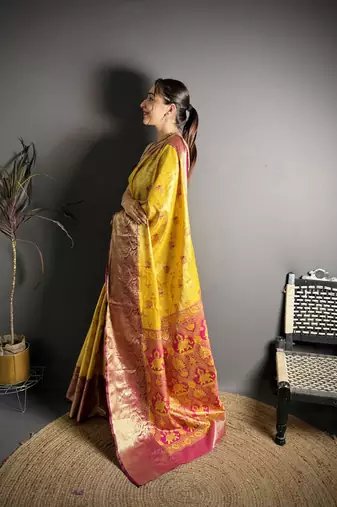 yellow kanjeevaram silk blend zari woven saree with unstitched blouse piece.