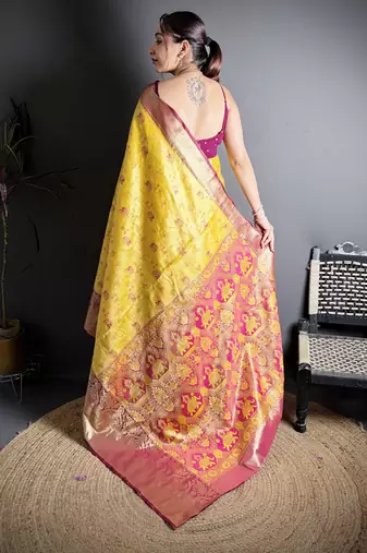 yellow kanjeevaram silk blend zari woven saree with unstitched blouse piece.