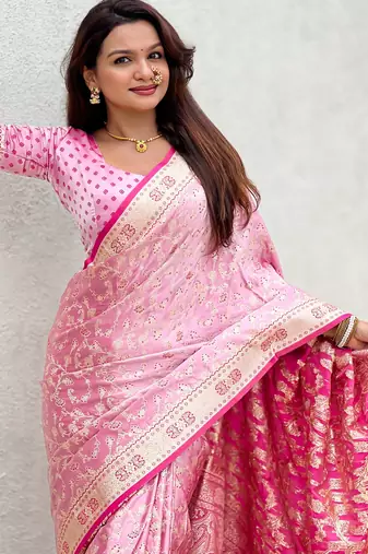 pink satin silk blend banarasi zari woven saree with unstitched blouse piece.