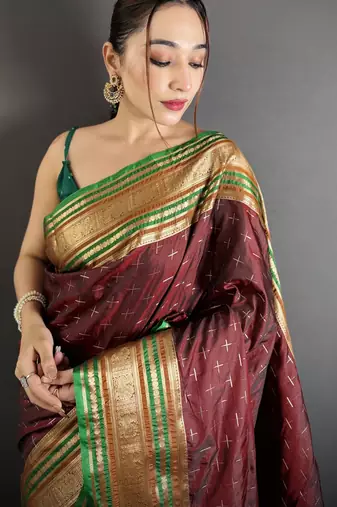 maroon silk blend zari woven saree with unstitched blouse piece.