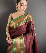 maroon silk blend zari woven saree with unstitched blouse piece.