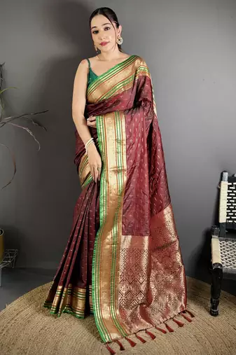 maroon silk blend zari woven saree with unstitched blouse piece.