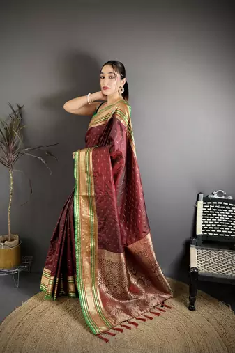 maroon silk blend zari woven saree with unstitched blouse piece.