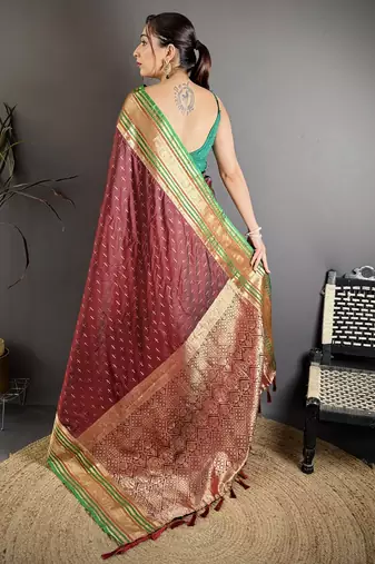 maroon silk blend zari woven saree with unstitched blouse piece.