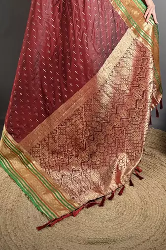maroon silk blend zari woven saree with unstitched blouse piece.