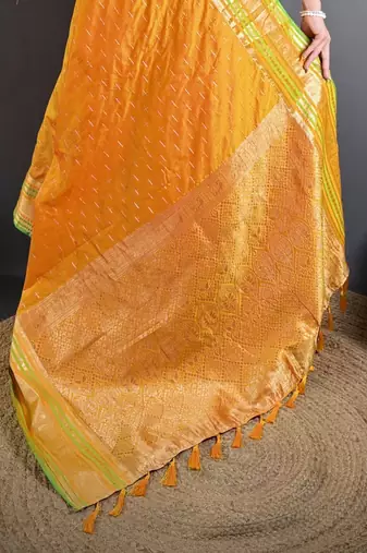 mustard silk blend zari woven saree with unstitched blouse piece.