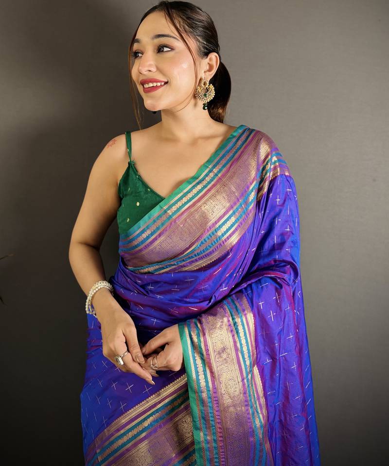 purple silk blend zari woven saree with unstitched blouse piece.
